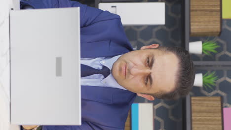 Vertical-video-of-Businessman-working-with-focus-serious.